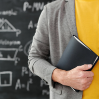 Teacher at blackboard