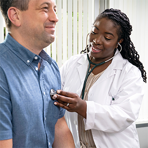 Doctor listening to patient's heart